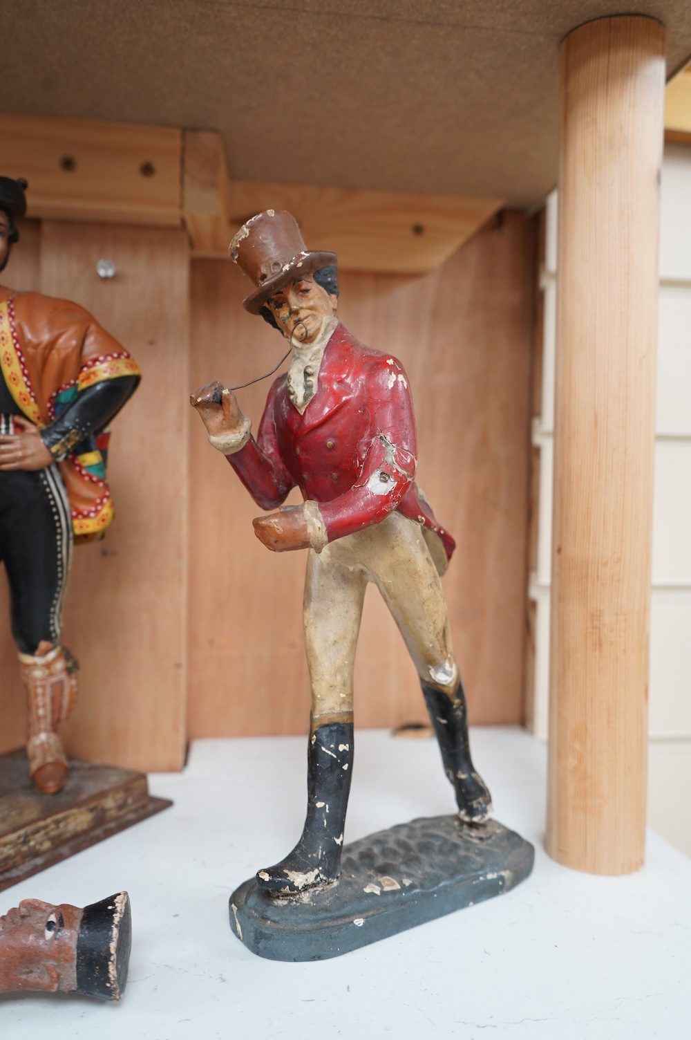 A Johnnie Walker advertising figure, two models of Spanish dancers and an Indian figural carving, tallest 30cm. Condition - poor